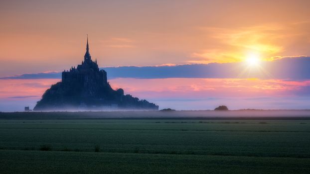 Mont Saint-Michel view in the sunrise light. Normandy, northern France