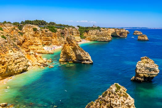 Praia da Marinha, beautiful beach Marinha in Algarve, Portugal. Navy Beach (Praia da Marinha), one of the most famous beaches of Portugal, located on the Atlantic coast in Lagoa Municipality, Algarve.