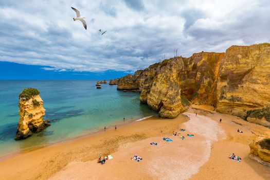 Praia Dona Ana beach with turquoise sea water and cliffs, Portugal. Beautiful Dona Ana Beach (Praia Dona Ana) in Lagos, Algarve, Portugal.