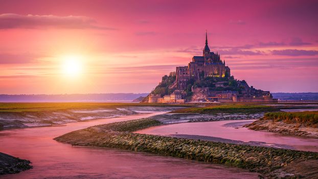 Panoramic view of famous Le Mont Saint-Michel tidal island at sunset, Normandy, northern France