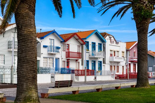 Street with colorful houses in Costa Nova, Aveiro, Portugal. Street with striped houses, Costa Nova, Aveiro, Portugal. Facades of colorful houses in Costa Nova, Aveiro, Portugal.