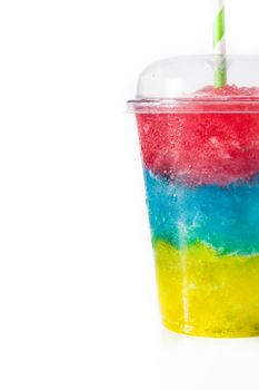 Colorful slushie of differents flavors with straw in plastic cup isolated on white background