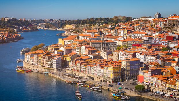 Panoramic view of Old city of Porto (Oporto) and Ribeira over Douro river, Portugal. Concept of world travel, sightseeing and tourism.