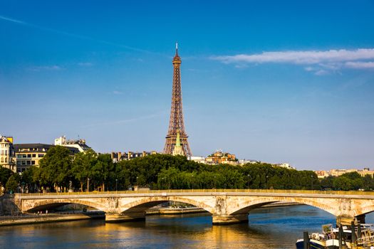 Paris Eiffel Tower and river Seine at sunset in Paris, France. Eiffel Tower is one of the most iconic landmarks of Paris. Eiffel tower in summer, Paris, France. The Eiffel Tower in Paris, France.