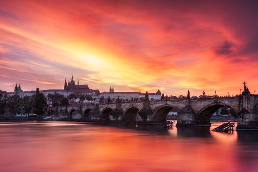 Charles Bridge in Prague in Czechia. Prague, Czech Republic. Charles Bridge (Karluv Most) and Old Town Tower. Vltava River and Charles Bridge. Concept of world travel, sightseeing and tourism.