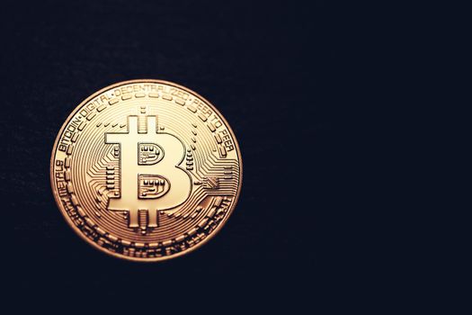 Crypto currency golden coin with bitcoin symbol on isolated on black background. Bitcoin Coin on black background. Bitcoin cryptocurrency.  Cryptocurrency Coin Concept.