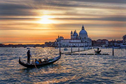 Canal with gondolas in Venice, Italy. Architecture and landmarks of Venice. Venice postcard with Venice gondolas.