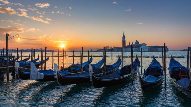 Canal with gondolas in Venice, Italy. Architecture and landmarks of Venice. Venice postcard with Venice gondolas.