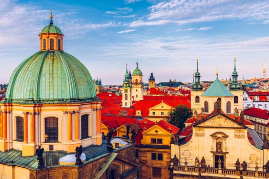 Scenic summer aerial panorama of the Old Town architecture in Prague, Czech Republic. Red roof tiles panorama of Prague old town.  Prague Old Town Square houses with traditional red roofs. Czechia.