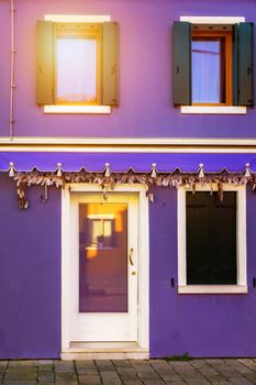 Colorful window of a house on the Venetian island of Burano, Venice. Facade of the houses of Burano close-up. Venice, Italy.