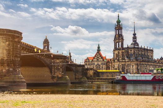 Augustus Bridge (Augustusbrucke) and Cathedral of the Holy Trinity (Hofkirche) over the River Elbe in Dresden, Germany, Saxony.