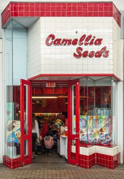 Kahului, Maui,, Hawaii, USA. - January 12, 2020: Camellia seeds store at Queen Kaahumanu shopping center. Red letters on white. People in store.