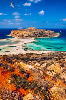 Balos Lagoon and Gramvousa island on Crete with seagulls flying over, Greece. Cap tigani in the center. Balos beach on Crete island, Greece. Crystal clear water of Balos beach.