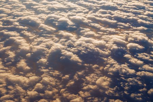 Blanket of clouds. Sun going below a blanket of clouds. On top of a blanket of clouds. Sun going below a blanket of clouds. Smooth view from above with a blanket of clouds.