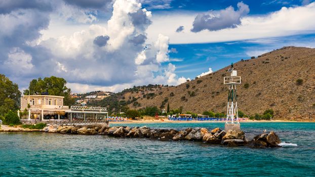 View of sunbeds awaiting tourists at the Greek island resort of Georgioupolis on Crete north coast. Georgioupoli is a resort village and former municipality in the Chania regional unit, Crete, Greece.