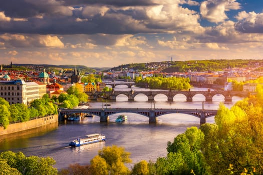 Scenic view of the Old Town pier architecture and Charles Bridge over Vltava river in Prague, Czech Republic. Prague iconic Charles Bridge (Karluv Most) and Old Town Bridge Tower at sunset, Czechia.