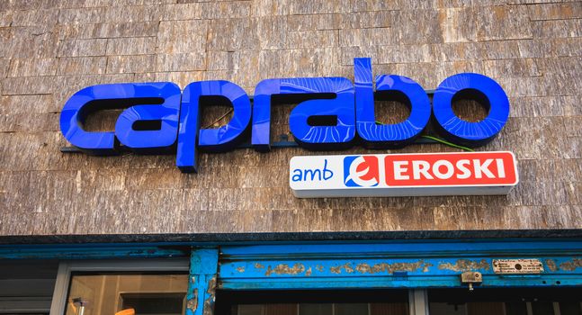 Barcelona, Spain - June 20, 2017: Detail of the sign of a grocery store Caprabo, a subsidiary of Eroski, a company and a sign of the Basque retail sector