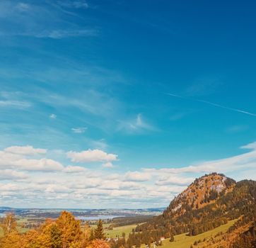 Beautiful nature of European Alps, landscape view of alpine mountains, lake and village in autumn season, travel and destination scenery