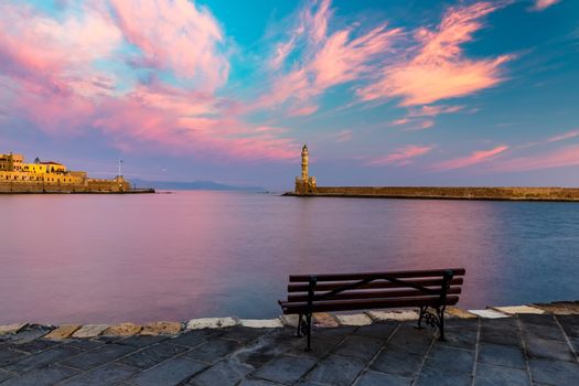 Panorama of venetian harbour waterfront and lighthouse in old harbour of Chania, Crete, Greece. Old venetian lighthouse in Chania, Greece. Lighthouse of the old Venetian port in Chania, Greece.