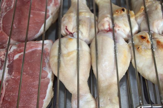 mixed meat grill with chicken and sausage cooked at barbecue