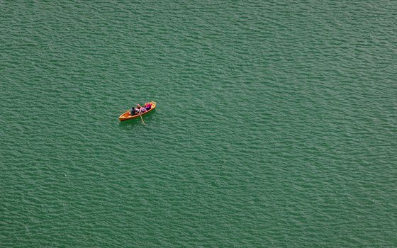 Lake Bled, Slovenia. Top view of a boat sailing in the lake. Bled lake is the most famous lake in Slovenia. Bled, Slovenia.