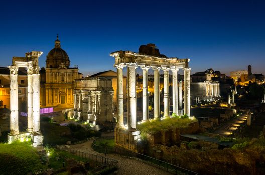 Roman ruins in Rome, Forum. Ancient ruins of the Romanum Forum. Ruins of Septimius Severus Arch and Saturn Temple, Rome, Italy.