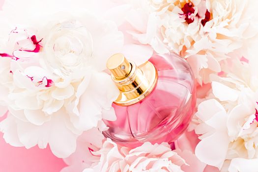 Luxurious fragrance bottle as chic perfume product on background of peony flowers, parfum ad and beauty branding design