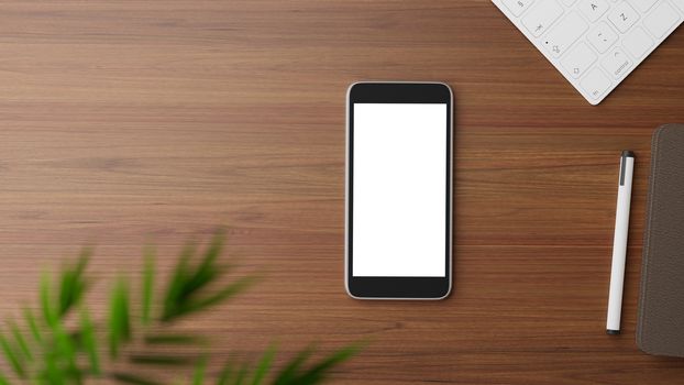 Copyspace of blank screen mockup mobile phone on wooden working table.