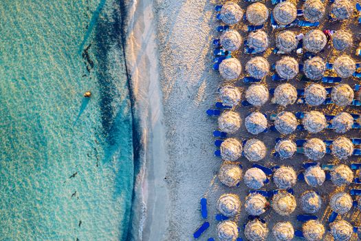Aerial view of beautiful tropical Elafonissi Beach with pink sand. View of a nice tropical Elafonissi beach from the air. Beautiful sky, sea, resort. Elafonissi beach, Crete, Greece.