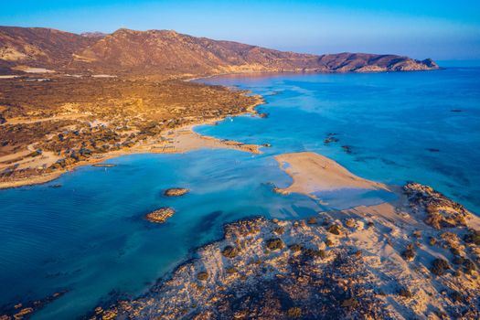 Aerial view of beautiful tropical Elafonissi Beach with pink sand. View of a nice tropical Elafonissi beach from the air. Beautiful sky, sea, resort. Elafonissi beach, Crete, Greece.