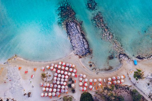 Aerial view of beautiful tropical Elafonissi Beach with pink sand. View of a nice tropical Elafonissi beach from the air. Beautiful sky, sea, resort. Elafonissi beach, Crete, Greece.