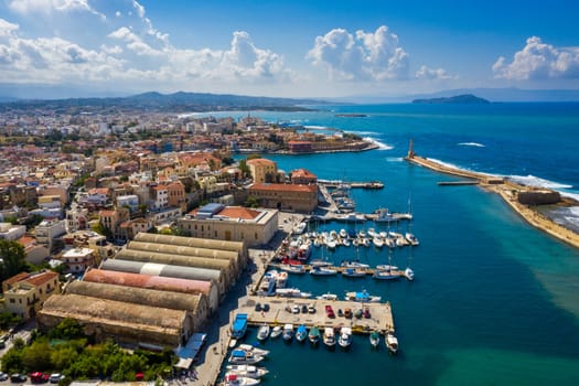 Picturesque old port of Chania. Landmarks of Crete island. Greece. Aerial view of the beautiful city of Chania with it's old harbor and the famous lighthouse, Crete, Greece.