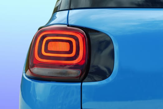 the tail lights on a luxury passenger car