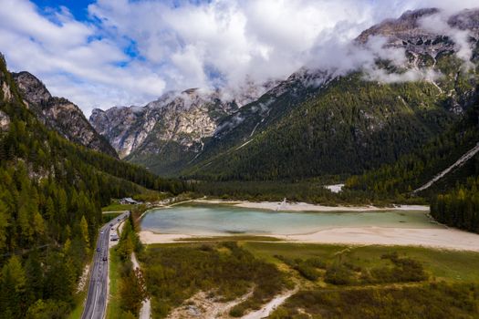 Lago di Landro, lake in the Dolomites in South Tyrol, Italy. Autumn peaceful alpine lake Durrensee or Lago di Landro. Mountains above the lake Lago di Landro. In the fall, Dolomites, Italy.
