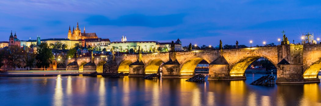 Charles Bridge in Prague in Czechia. Prague, Czech Republic. Charles Bridge (Karluv Most) and Old Town Tower. Vltava River and Charles Bridge. Concept of world travel, sightseeing and tourism.