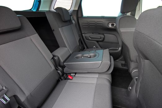 armrest in the car with can holders, rear seats