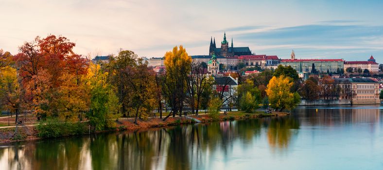 Prague autumn landscape. Prague autumn landscape view to Saint Vitus cathedral. Prague. Prague panorama. Prague, Czech Republic. Scenic autumn aerial view of the Old Town with red foliage. Czechia.