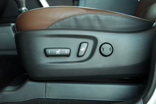 Buttons for adjusting seat position. Car interior detail