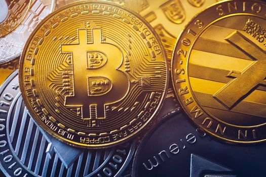 Set of cryptocurrencies with Bitcoin, Etherium, Ripple, Litecoin. Cryptocurrencys new digital money. Bitcoin on the front as the leader. Bitcoin as most important cryptocurrency.
