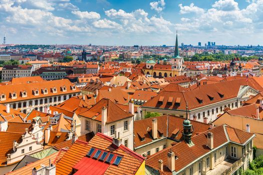 Old town of Prague. Czech Republic over river Vltava with Charles Bridge on skyline. Prague panorama landscape view with red roofs.  Prague view from Petrin Hill, Prague, Czechia.