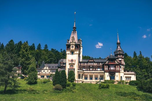 Peles Castle, Romania. Beautiful famous royal castle and ornamental garden in Sinaia landmark of Carpathian Mountains in Europe