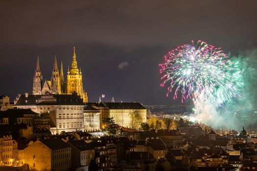 Fireworks over the Old Town of Prague, Czech Republic. New Year fireworks in Prague, Czechia. Prague fireworks during New Year Celebration near St. Vitus Cathedral, Prague, Czech republic.
