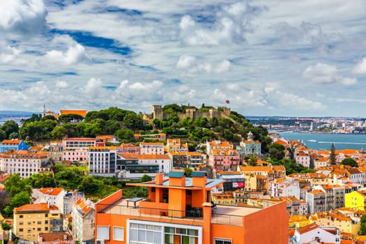 Lisbon, Portugal skyline with Sao Jorge Castle. Panoramic aerial view of Lisbon, Portugal. Panorama view of old town Lisbon and Sao Jorge Castle, the capital and the largest city of Portugal.