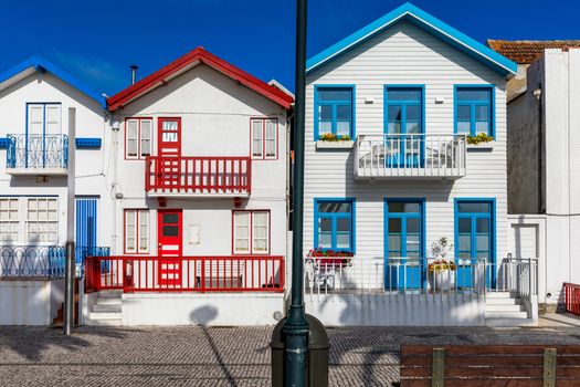 Street with colorful houses in Costa Nova, Aveiro, Portugal. Street with striped houses, Costa Nova, Aveiro, Portugal. Facades of colorful houses in Costa Nova, Aveiro, Portugal.