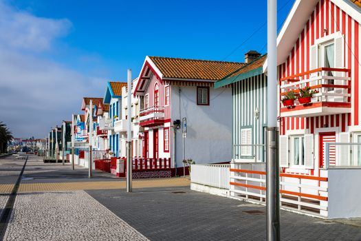 Street with colorful houses in Costa Nova, Aveiro, Portugal. Street with striped houses, Costa Nova, Aveiro, Portugal. Facades of colorful houses in Costa Nova, Aveiro, Portugal.