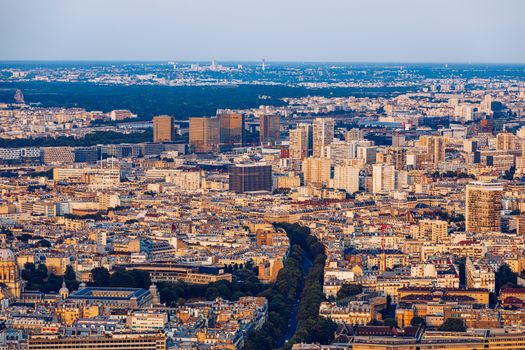 Classic Parisian buildings. Aerial view of roofs. Paris roofs panoramic overview at summer day, France. View of typical parisian roofs with mansards and chimneys in Paris, France.