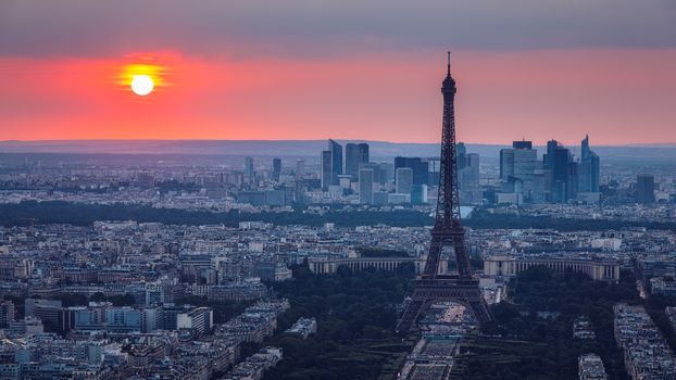 Panoramic aerial view of Paris, Eiffel Tower and La Defense business district. Aerial view of Paris at sunset. Panoramic view of Paris skyline with Eiffel Tower and La Defense. Paris, France. 