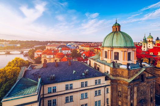 Scenic summer aerial panorama of the Old Town architecture in Prague, Czech Republic. Red roof tiles panorama of Prague old town.  Prague Old Town Square houses with traditional red roofs. Czechia.