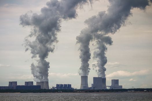 Multiple Coal Fossil Fuel Power Plant Smokestacks Emit Carbon Dioxide Pollution