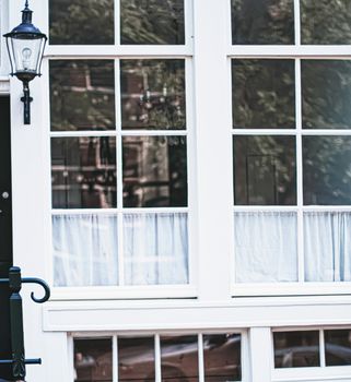 Architectural detail of a building on the main city center street of Amsterdam in Netherlands, european architecture